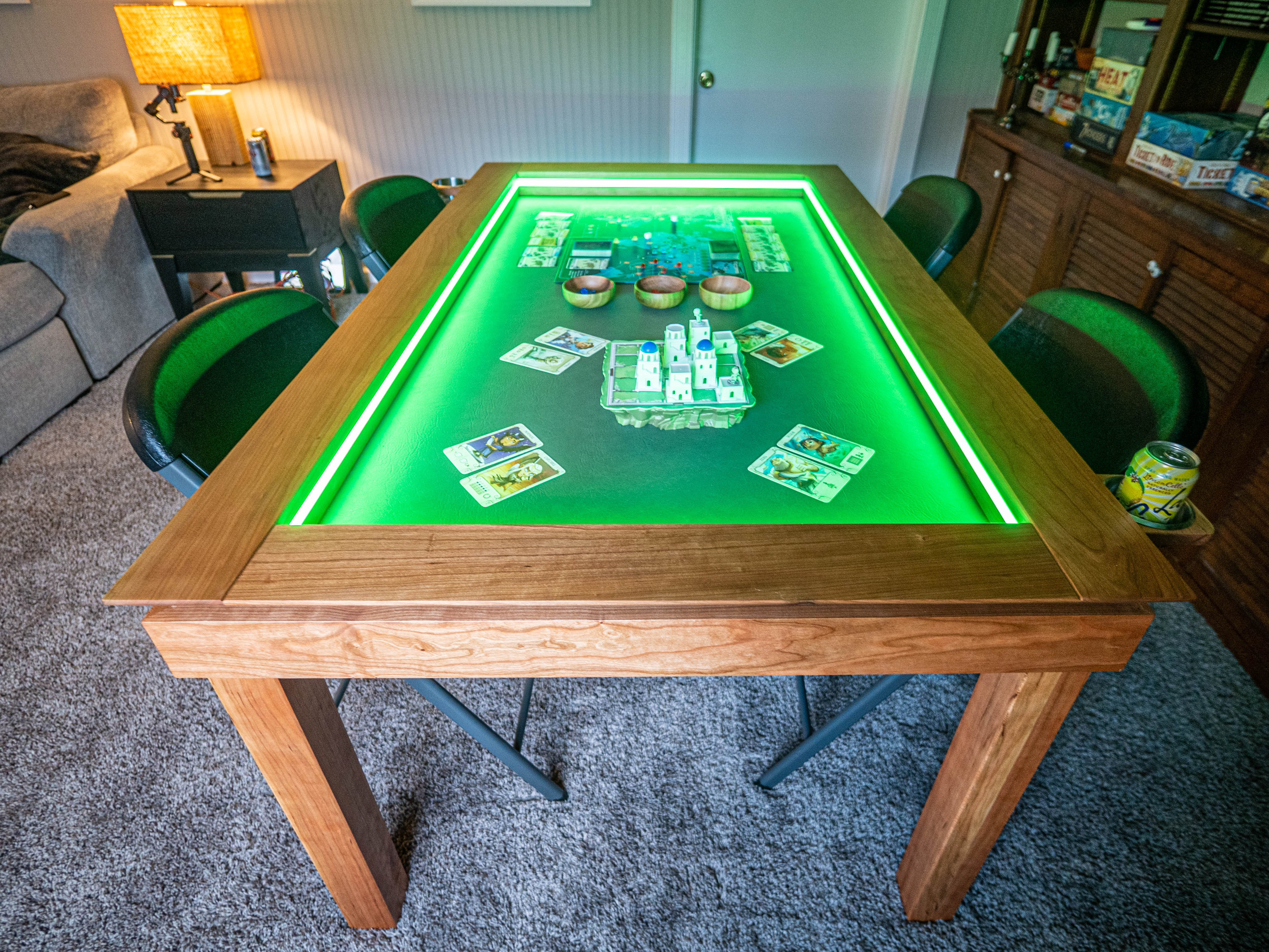 Ultimate gaming table lit in blue during play